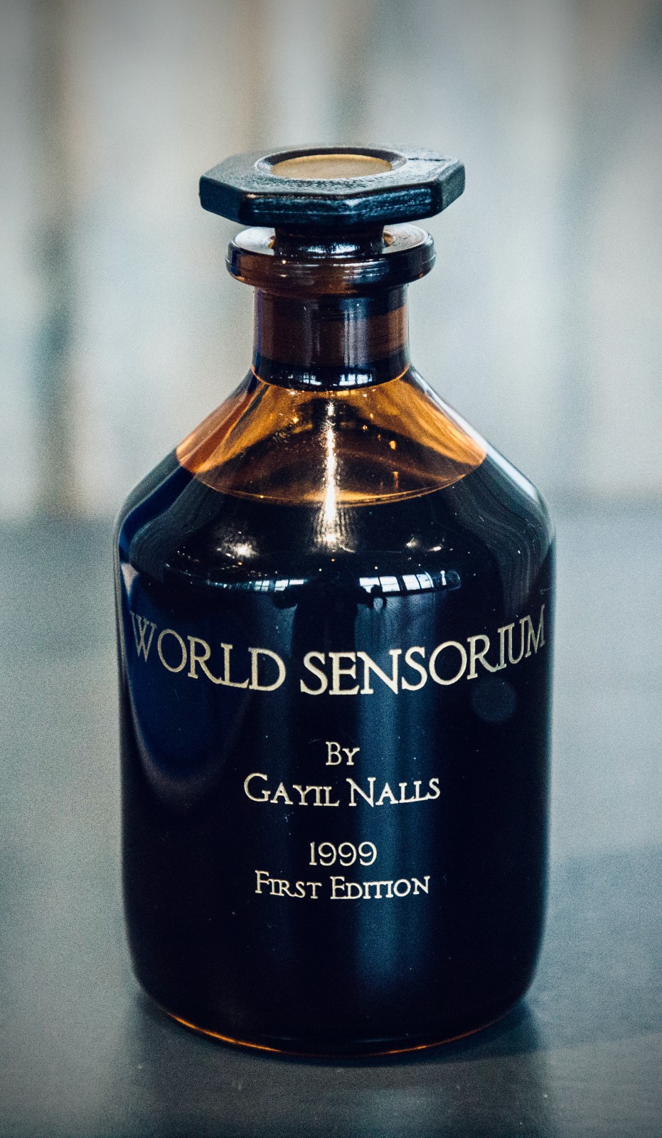 Gayil Nalls, *World Sensorium,* 1999-2000, World Aromatic Phytogenic Material (100ml at 25 in Amber Borosilicate Bottle), Photo by Bert Brouwenstijn (Displayed in the exhibition *Aromatic Art (Re-)constructed: In Search of Lost Scents* at Vrije Universiteit Amsterdam in 2017).